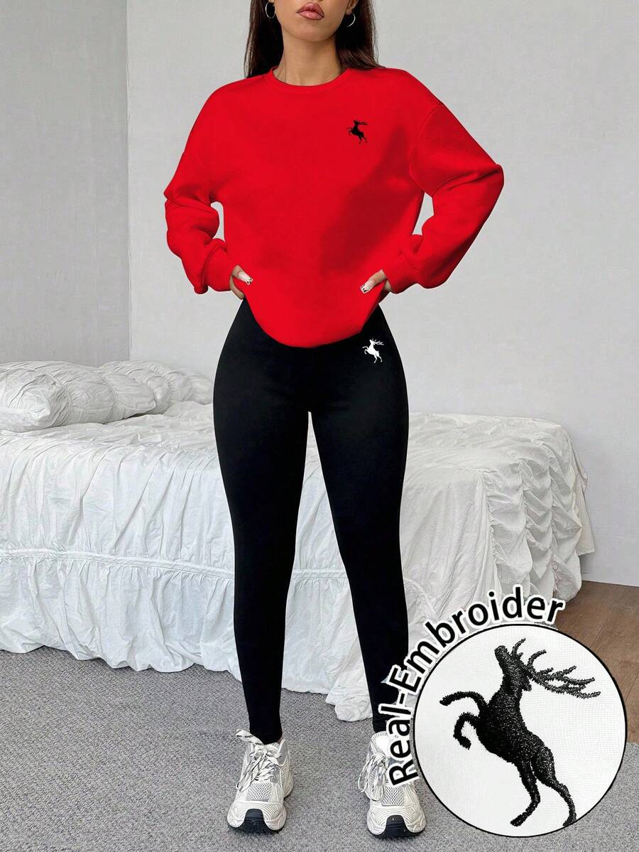 red crew neck sweatshirt with deer embroidered logo