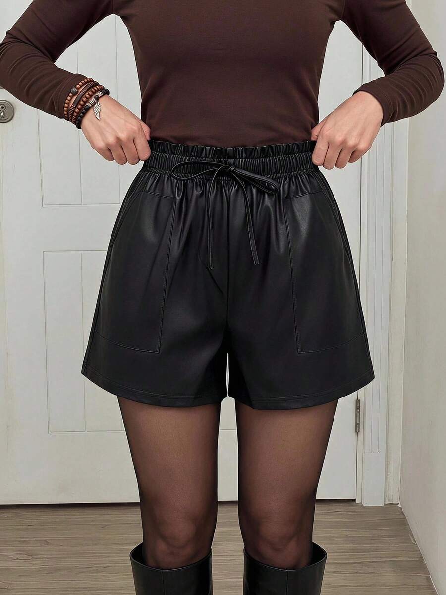 black cotton paperbag waist shorts with pockets