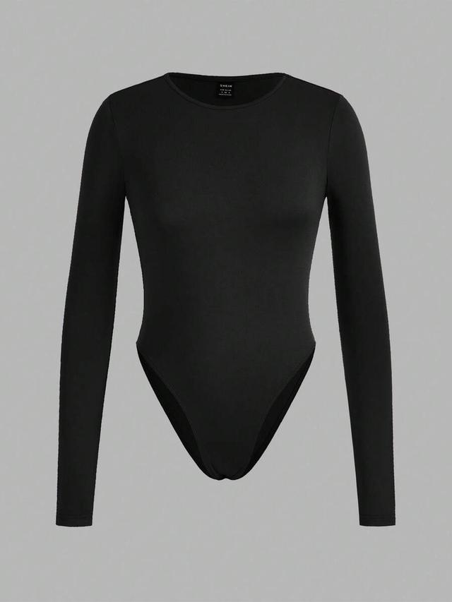 black long sleeve crew neck bodysuit