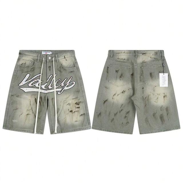 grey-green distressed denim jorts with rhinestone lettering