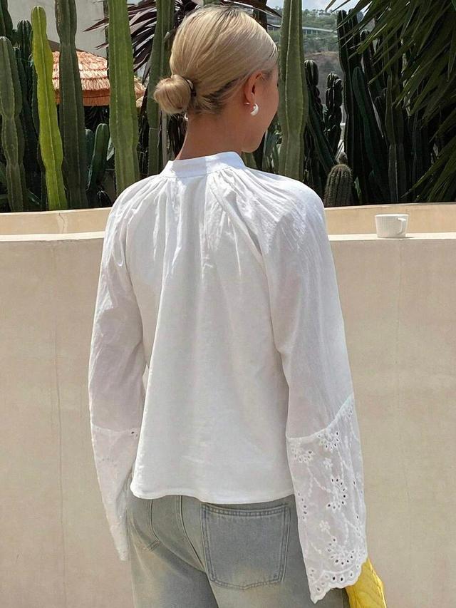 white cotton blouse with eyelet embroidery detail
