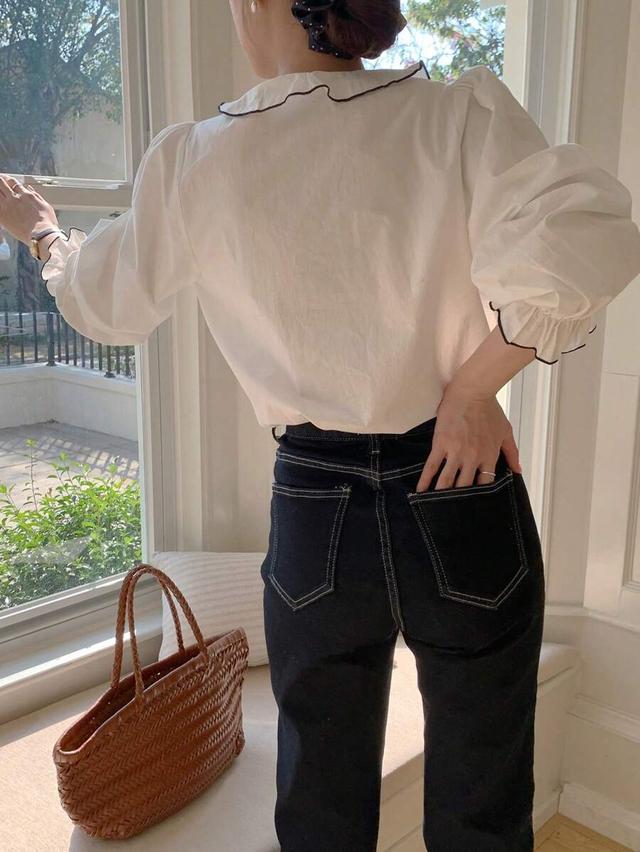 white cotton blouse with ruffle trim collar