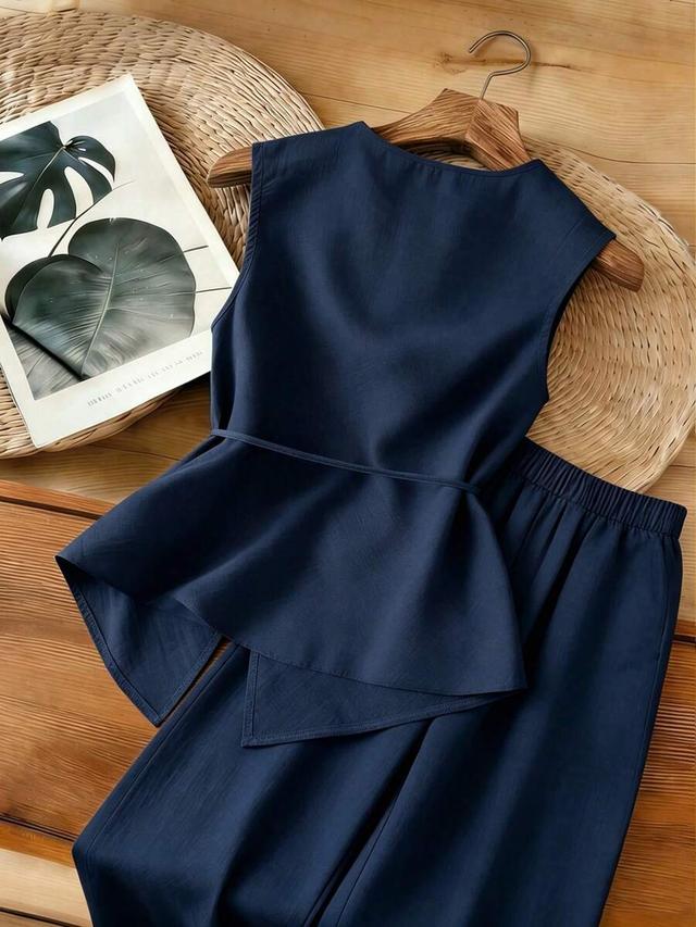 navy blue textured sleeveless asymmetrical top and pants set