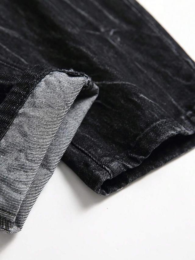 black distressed denim jeans with lightning print
