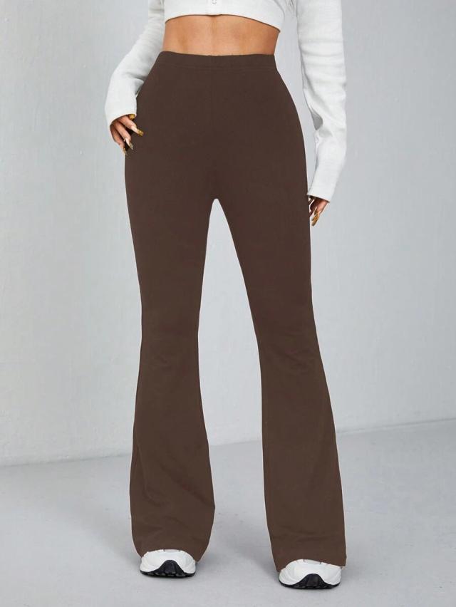 brown fitted elastic waist flare trousers