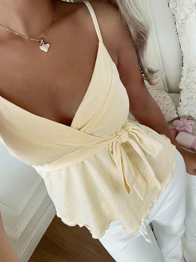 pale yellow side tie ruffle hem camisole top