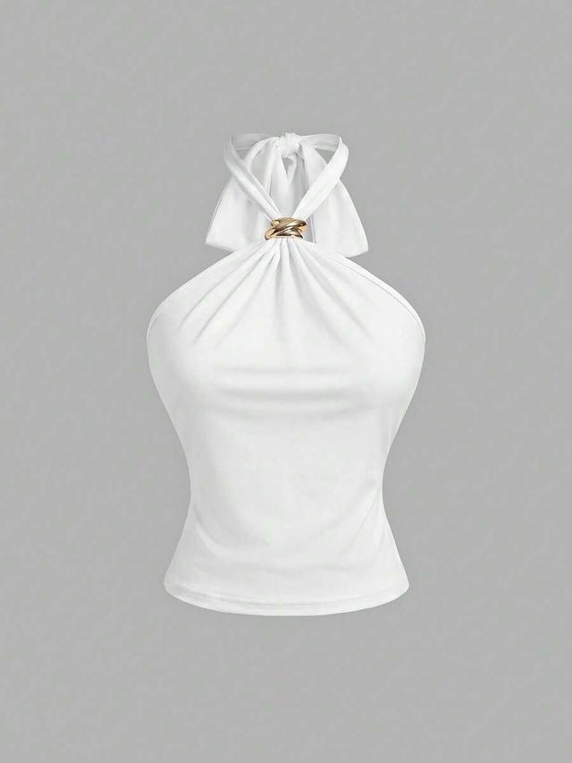 white three halter neck camisoles in black white and brown polka