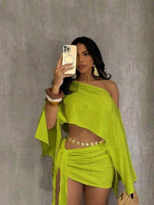 lime green textured off shoulder batwing sleeve top and tie skirt