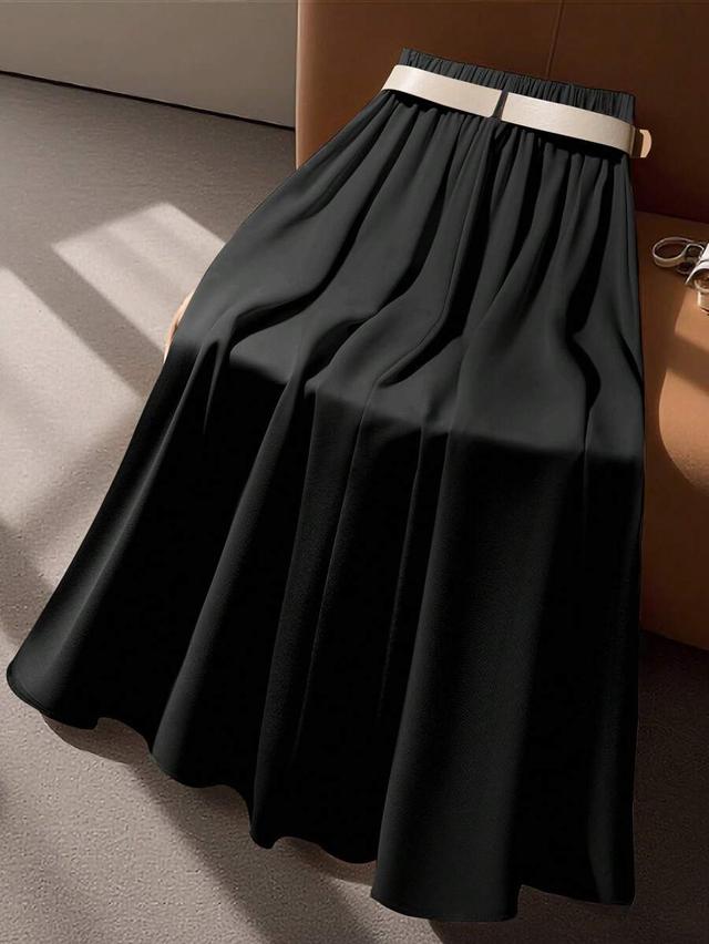 black pleated midi skirt with beige belt