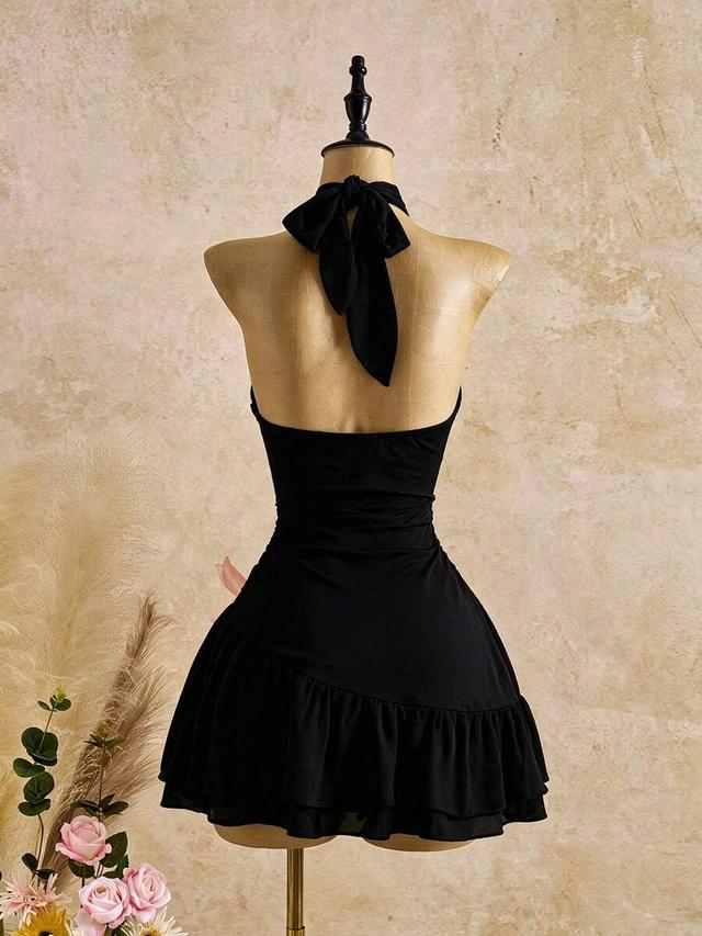 black sleeveless halter mini dress with removable flower brooch