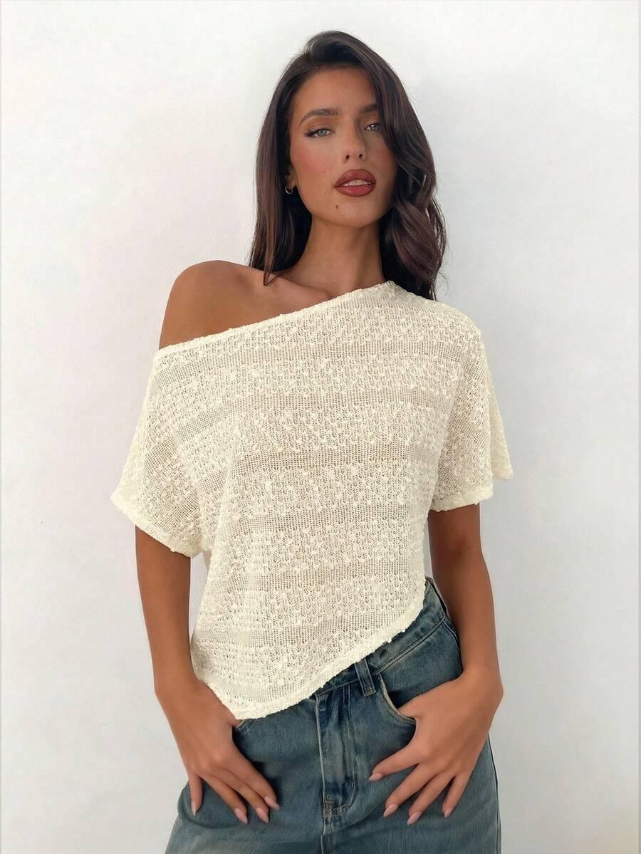 cream asymmetrical hand-crocheted sheer knit beach top