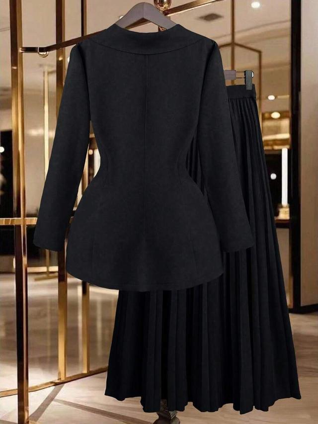minimalist black blazer and pleated skirt set