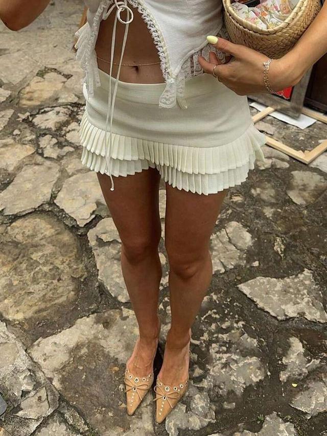 pale yellow low waist pleated ruffle hem mini skirt
