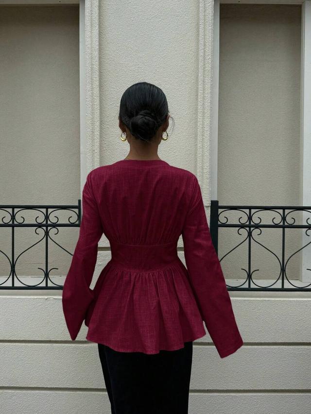 burgundy long sleeve double-breasted cinched waist top