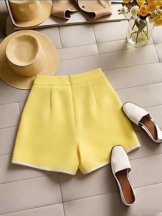 yellow a-line shorts with white trim