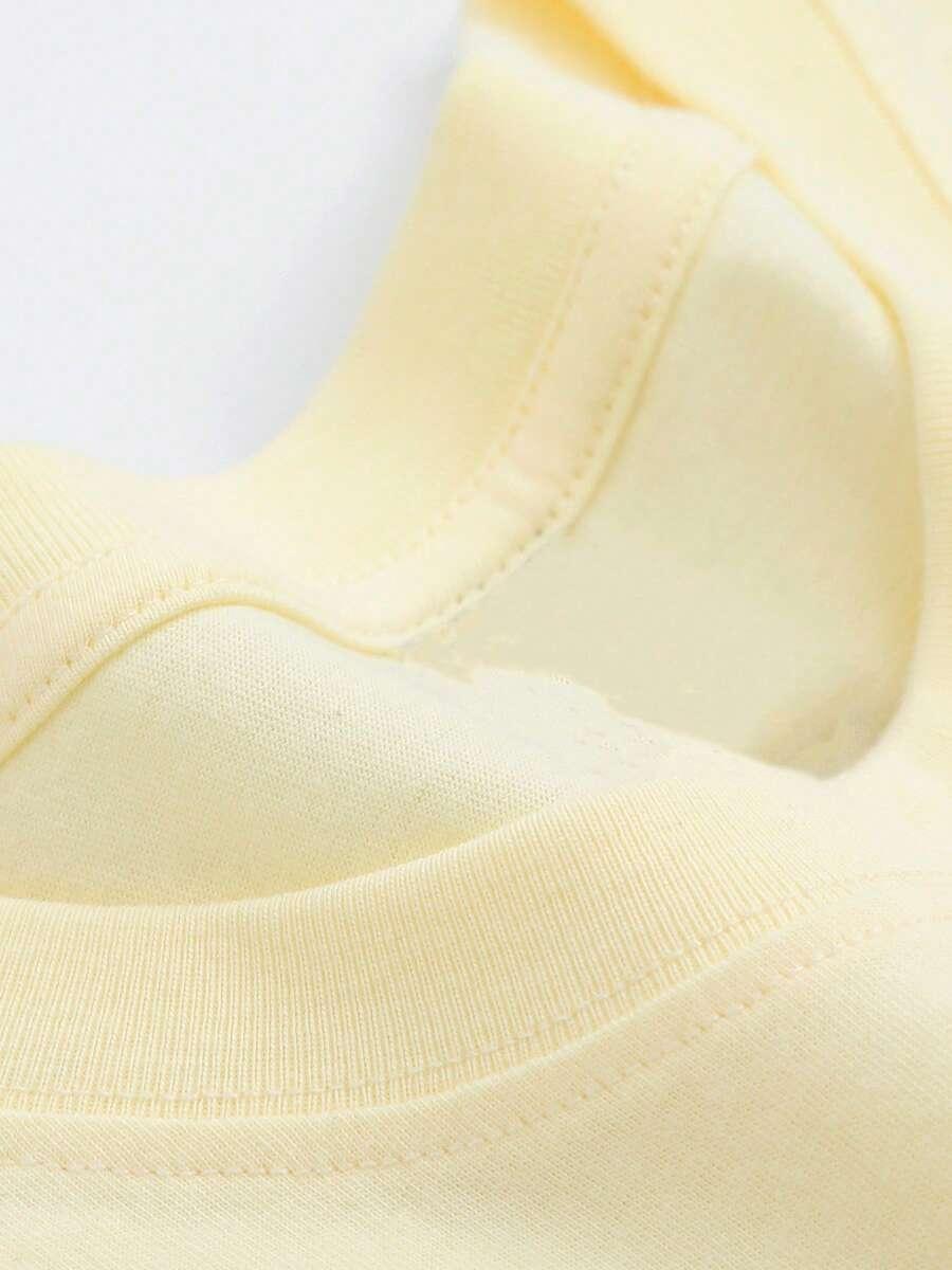 pale yellow oversized cotton crew neck t-shirt with graphic print