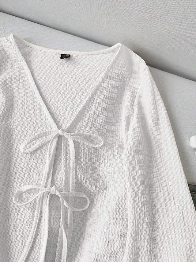 white textured v-neck tie front flare sleeve blouse
