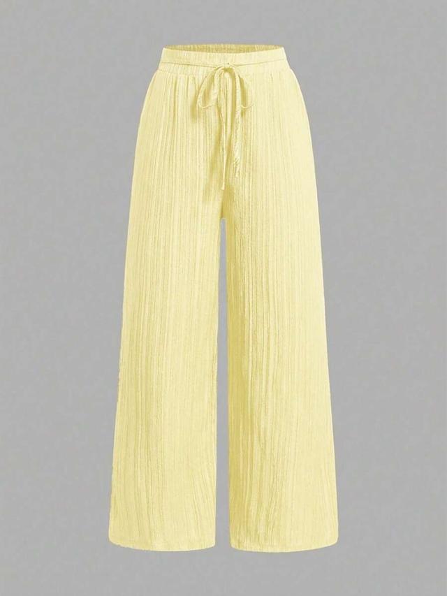 yellow textured straight leg drawstring trousers