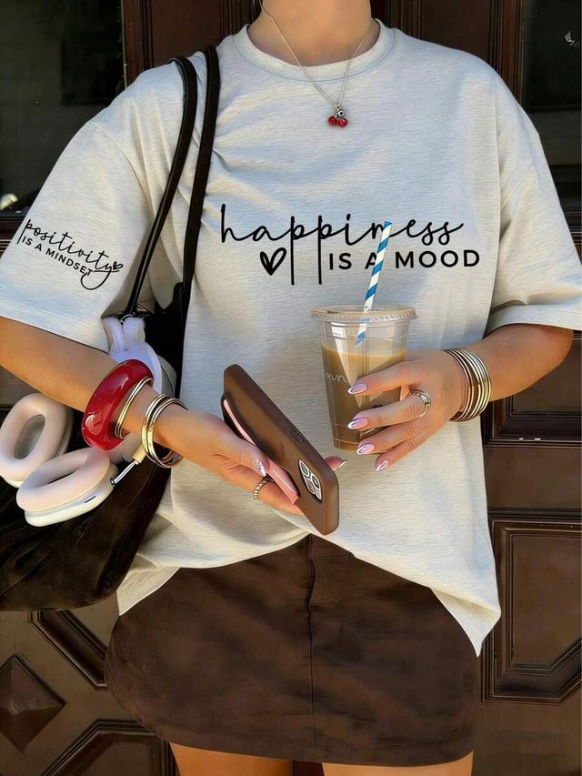 light beige knitted t-shirt with positive quote print