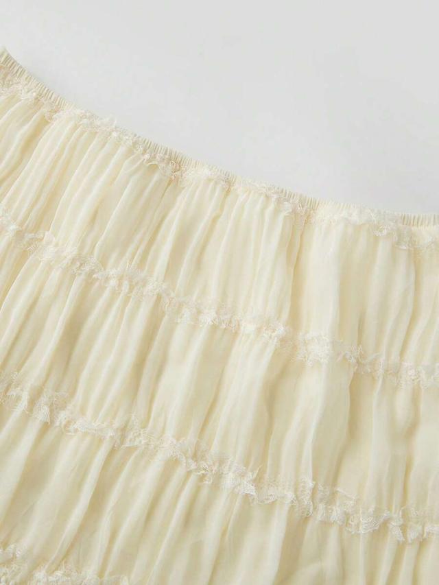 pale yellow backless halter crop top and smocked lace mini skirt