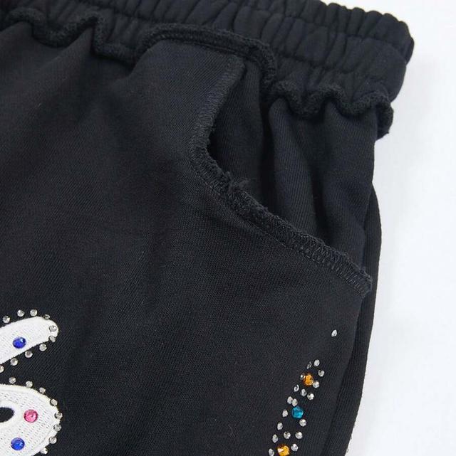 black knee length shorts with studded embroidery
