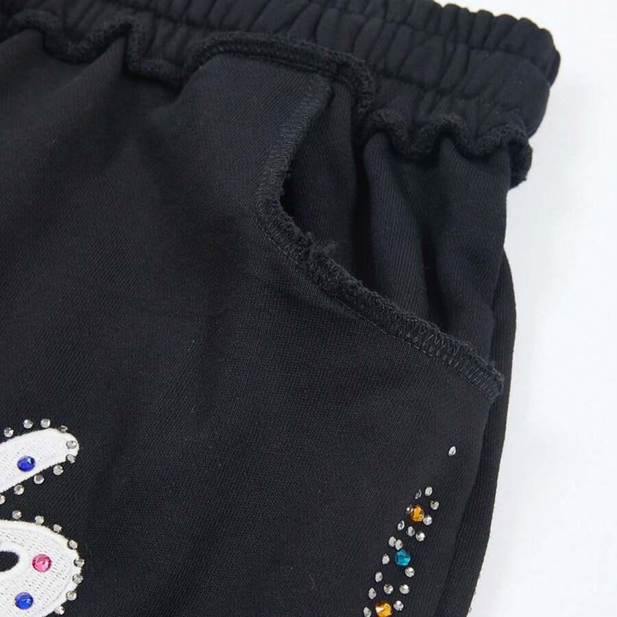 black knee length shorts with studded embroidery