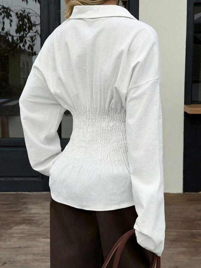 white cotton waist-fitted long sleeve button-up blouse