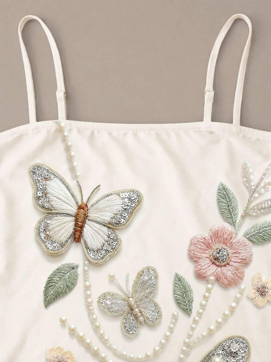 cream spaghetti strap mini dress with butterfly print