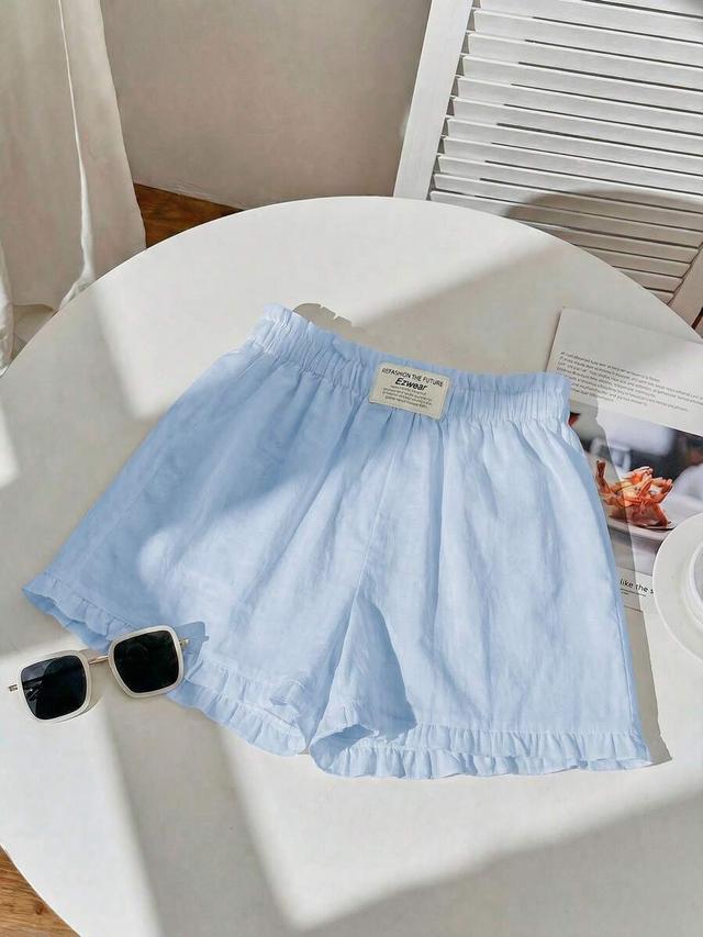 light blue striped ruffle hem casual shorts
