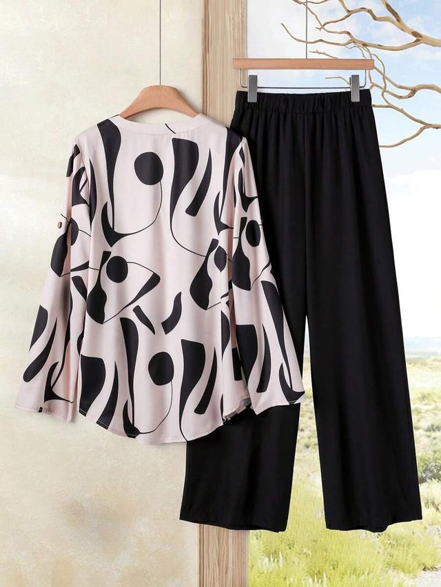 pink and black abstract print long sleeve blouse