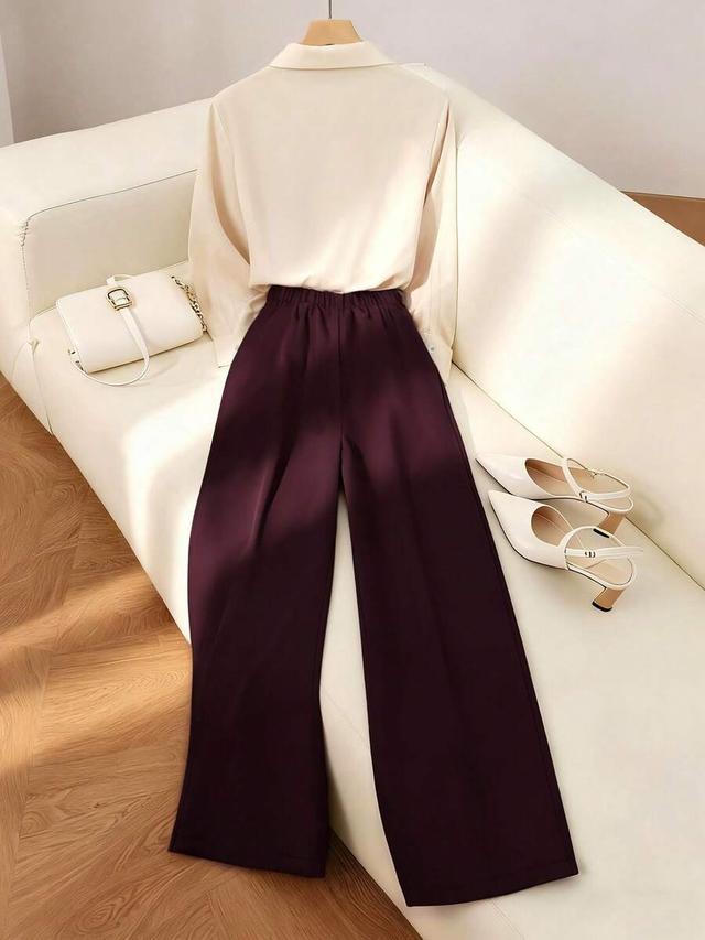 burgundy long sleeve blouse and purple straight leg trousers