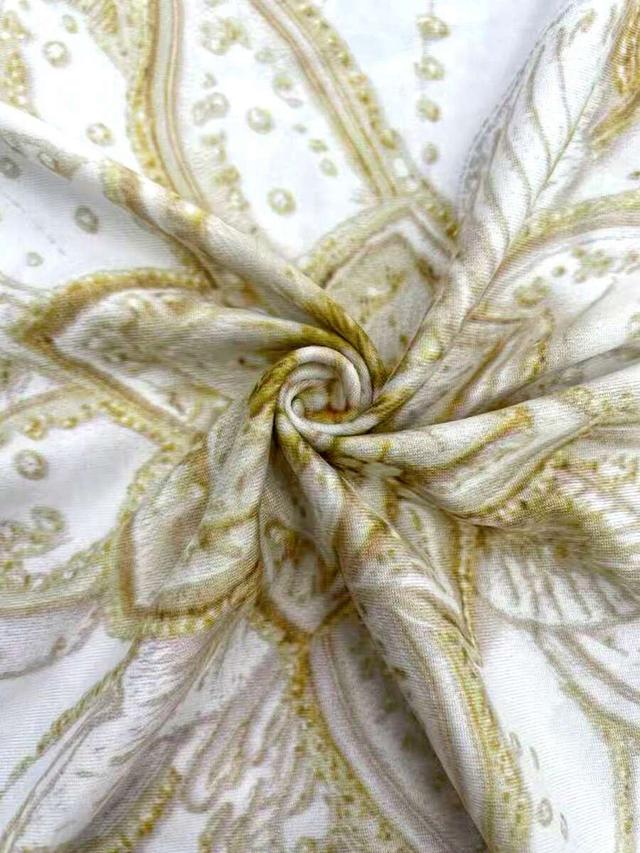 patterned gold halter top with intricate gold floral embroidery