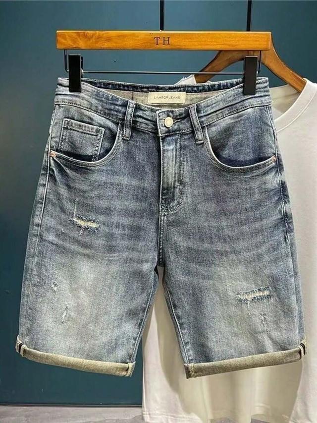 medium blue vintage washed ripped denim shorts with embroidered pocket