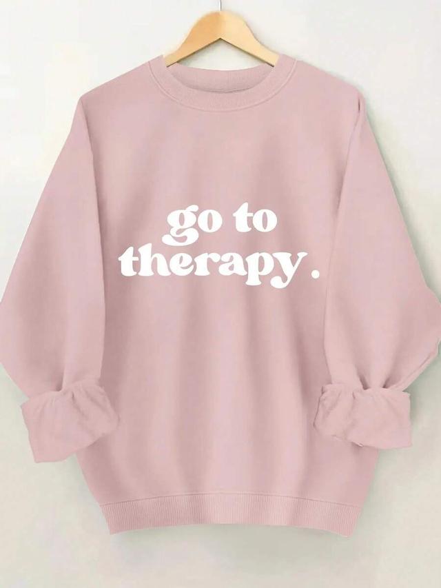 pink crewneck sweatshirt with white graphic print