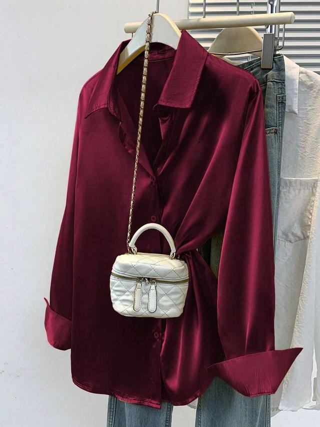 white women's burgundy satin button-down collared shirt