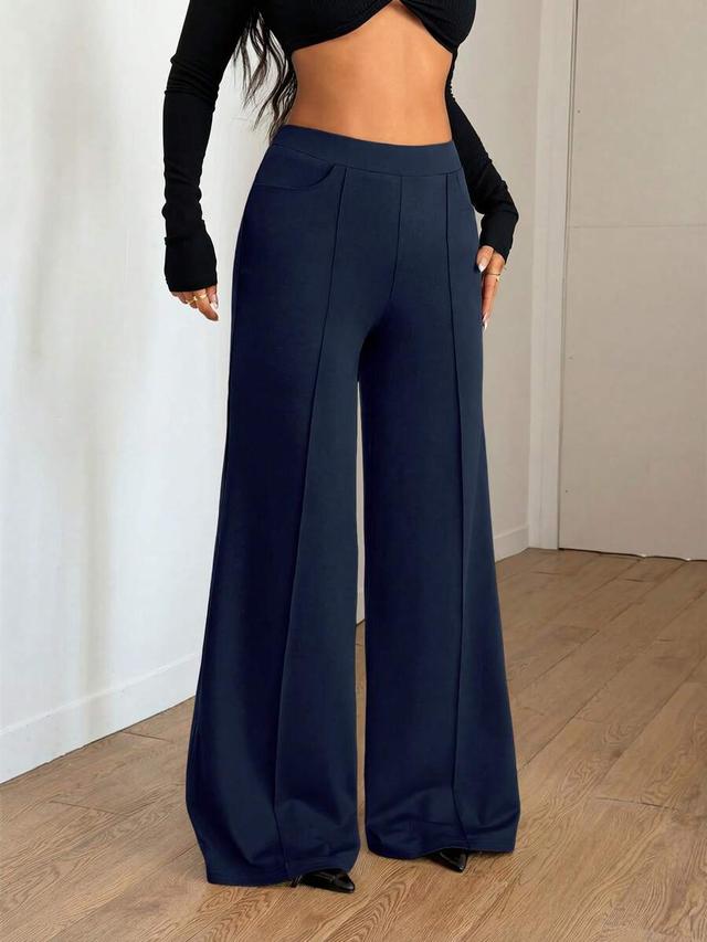 navy blue minimalist wide leg trousers with seam detail