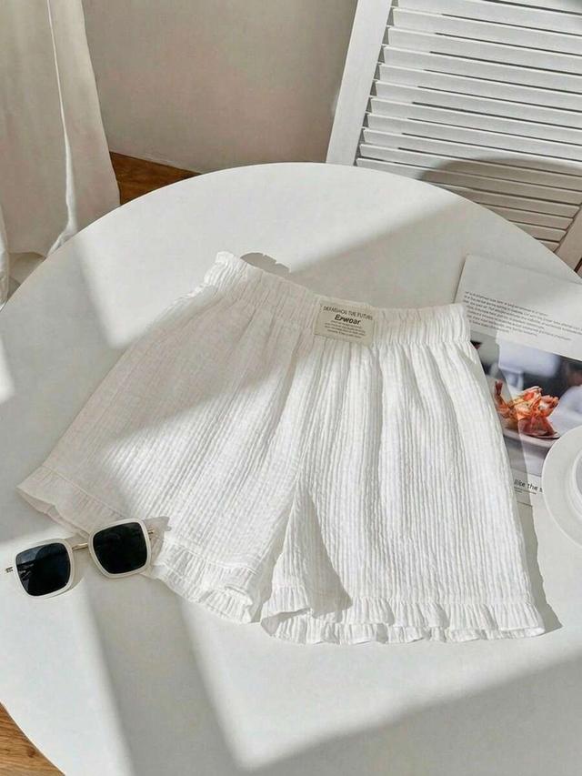 white and white striped ruffle paperbag waist shorts