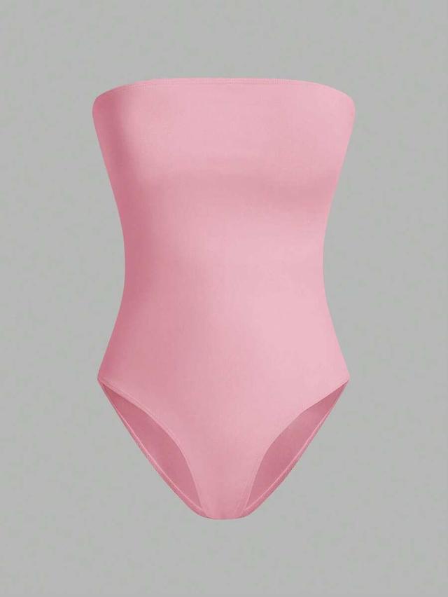pink seamless strapless bodysuit in black white and pink