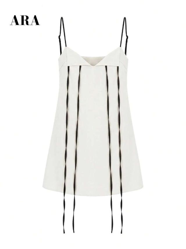 white cotton mini dress with black tie detail
