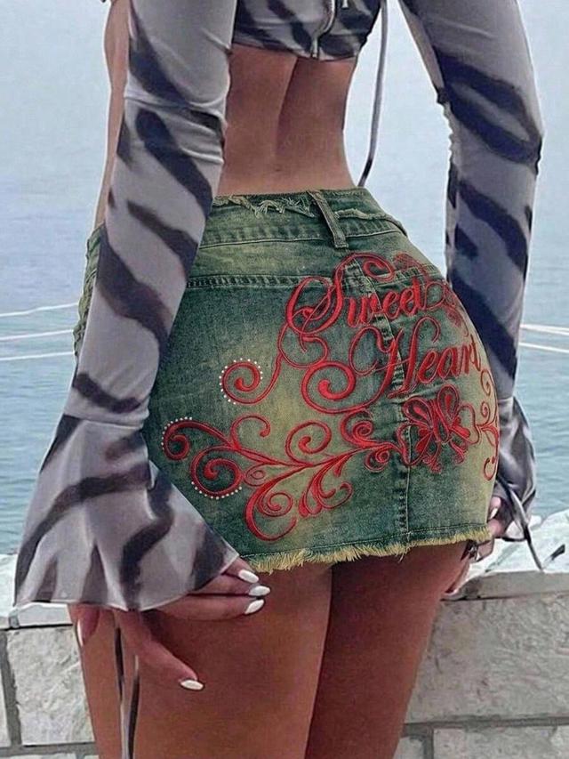 greenish blue distressed denim mini skirt with red embroidery