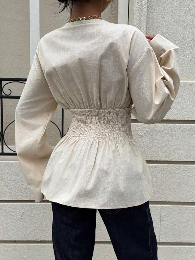 apricot cotton v-neck peplum blouse with bishop sleeves