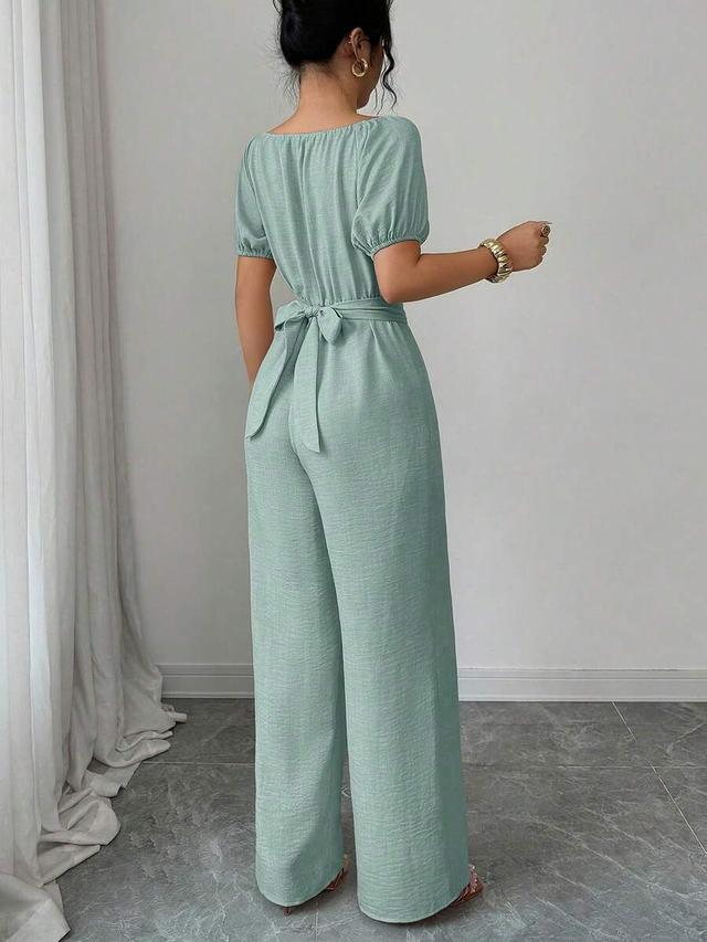 elegant khaki commuter jumpsuit with wooden bead detail