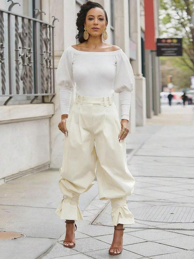 cream high waist pleated balloon pants with ruffle hem