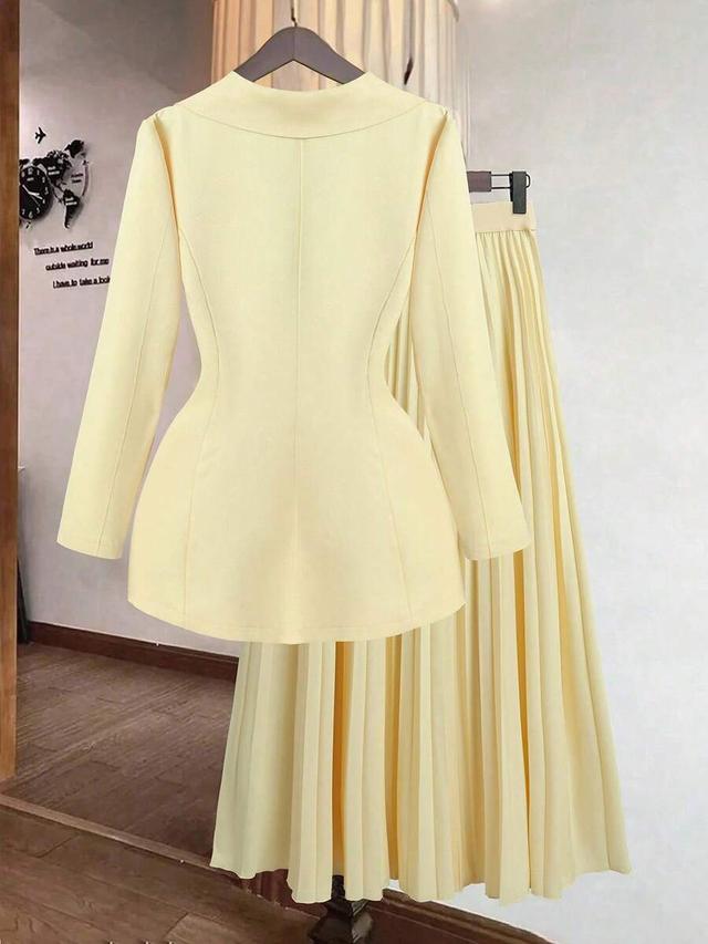 yellow double breasted blazer and pleated skirt set