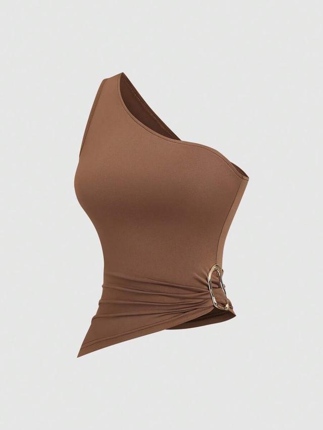 brown three one-shoulder asymmetrical top in white brown and black