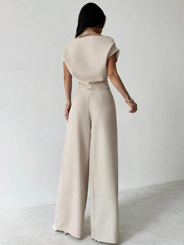 beige off-shoulder blouse with matching wide-leg trousers
