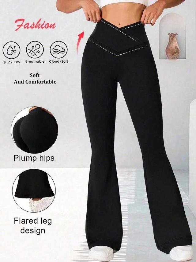black high-waisted crossover flare yoga pants