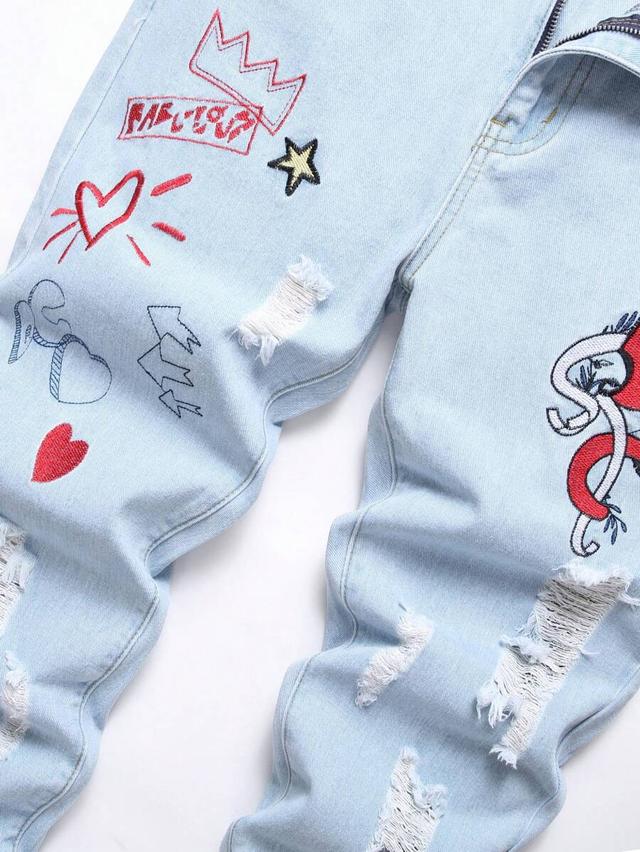 light blue slim fit light wash denim jeans with graphic embroidery