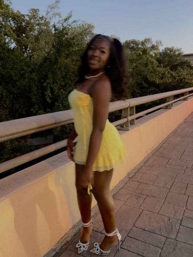 yellow strapless mini dress with fabric rose detail