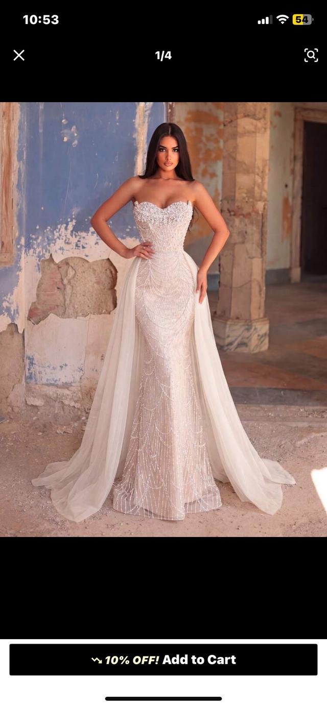 heavily beaded strapless mermaid gown with tulle overskirt
